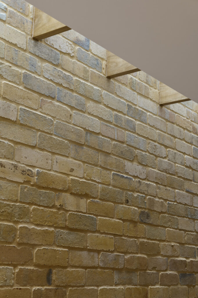 Detail of the strip skylight and feature brickwall.