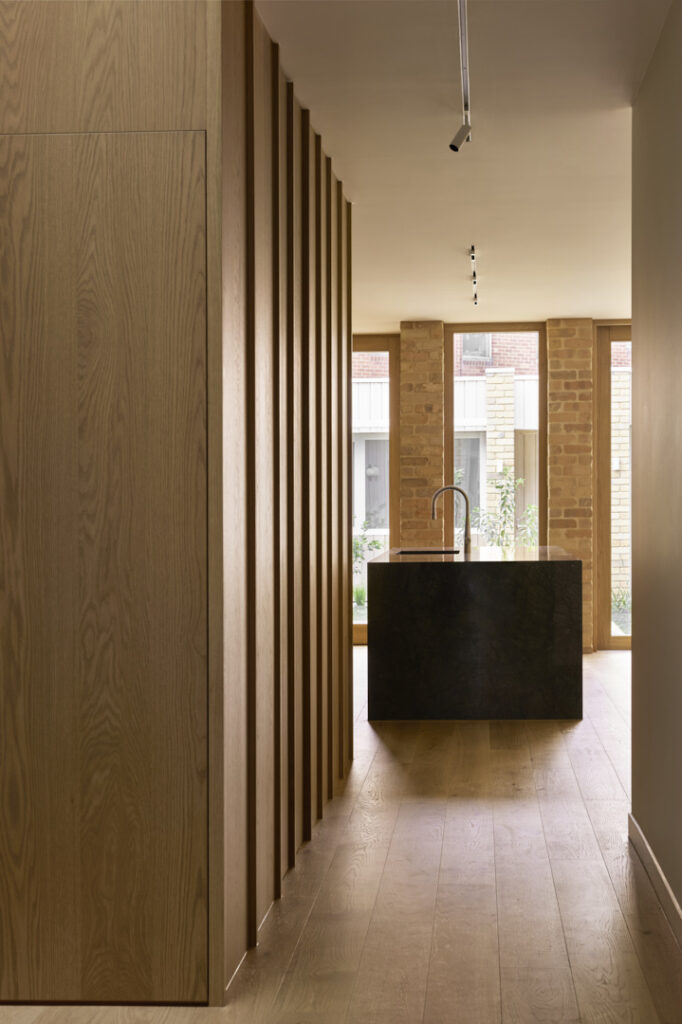 A view towards the kitchen through the hallway.